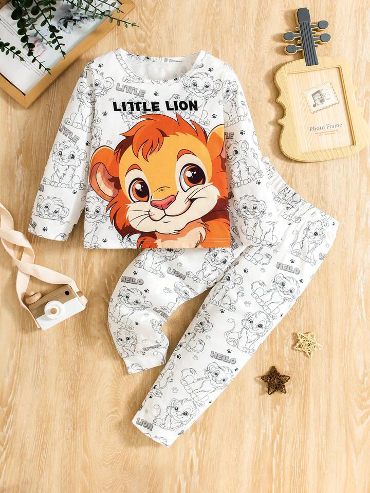 Conjunto lindo de tema de león de dibujos animados para niños pequeños, con camisa de manga larga y pantalones, hecho de tela suave y cómoda para proteger la piel sensible.